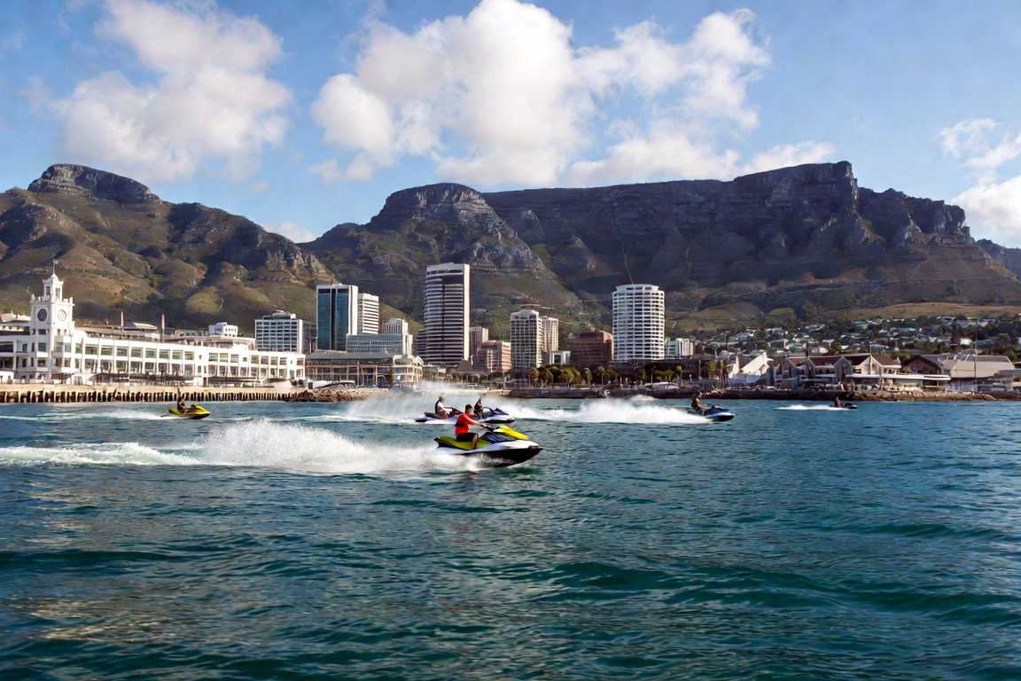 Group of jet skis in front of the V&A Waterfront and Table Mountain